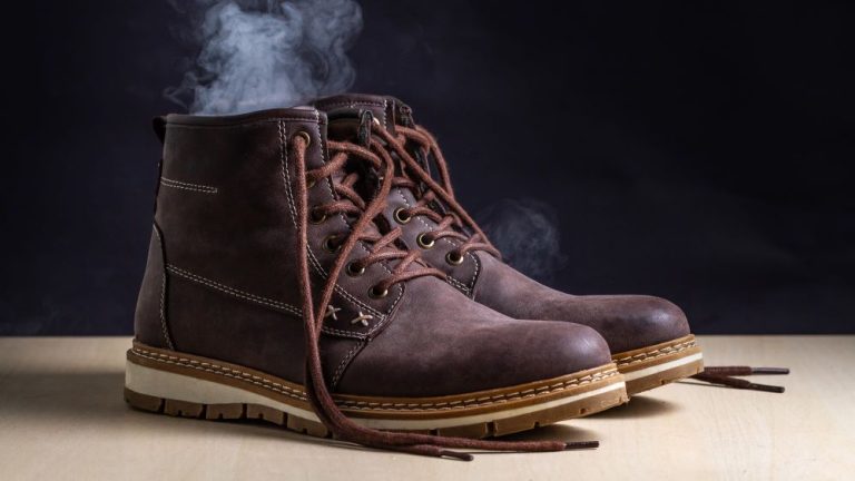 Pair of Brown work boots with a smelly haze drifting out of them